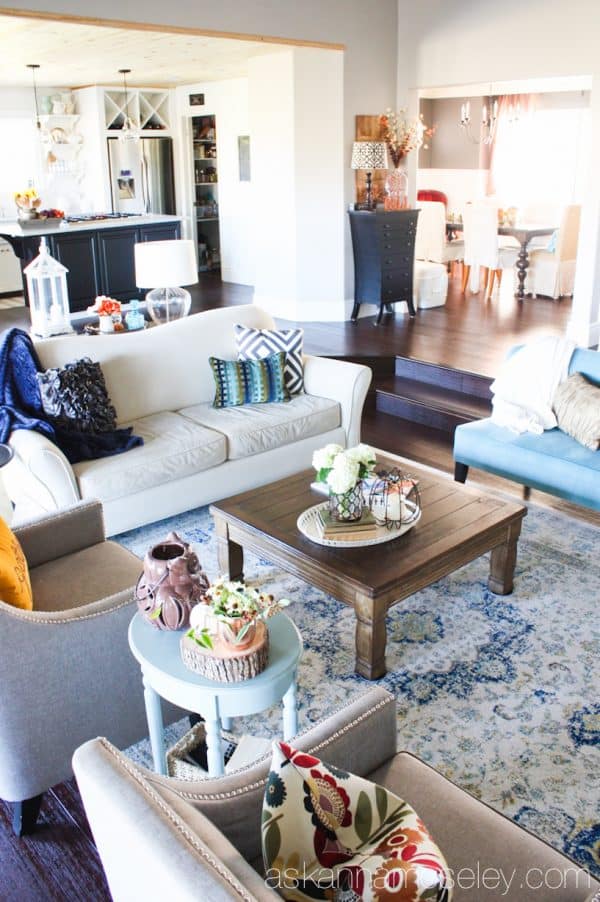 By adding a larger rug, a little more seating and the proper size coffee table, I was able to take my living room from boring to fabulous! - Ask Anna