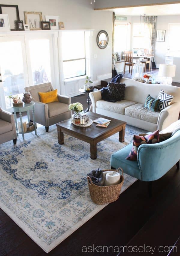 By adding a larger rug, a little more seating and the proper size coffee table, I was able to take my living room from boring to fabulous! - Ask Anna