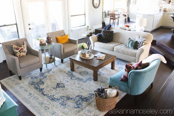 By adding a larger rug, a little more seating and the proper size coffee table, I was able to take my living room from boring to fabulous! - Ask Anna