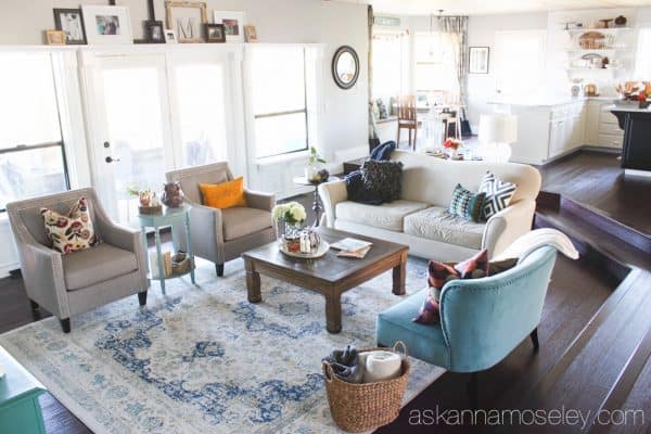 By adding a larger rug, a little more seating and the proper size coffee table, I was able to take my living room from boring to fabulous! - Ask Anna