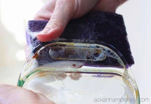 This is a really simple tip for how to clean baked-on grease off pots, pans & baking dishes. You will be AMAZED at how easy it is to get tough grease off with just a sponge and a little dish soap | Ask Anna