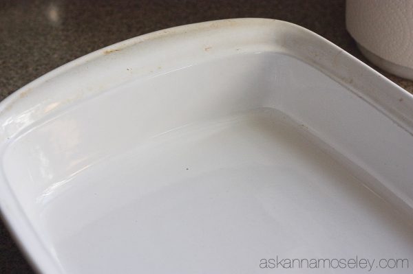 This is a really simple tip for how to clean baked-on grease off pots, pans & baking dishes. You will be AMAZED at how easy it is to get tough grease off with just a sponge and a little dish soap | Ask Anna