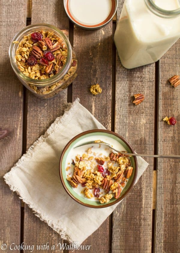 Granola filled with pumpkin puree, toasted pecans, sweet cranberries, and maple syrup. This maple pumpkin pecan granola is the most amazing breakfast and snack for fall. 