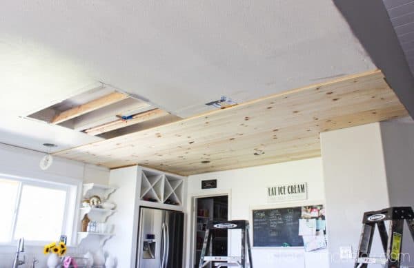 Natural wood ceiling in a kitchen - see the transformation from an outdated light box, to pendants and a beautiful pine wood ceiling | Ask Anna