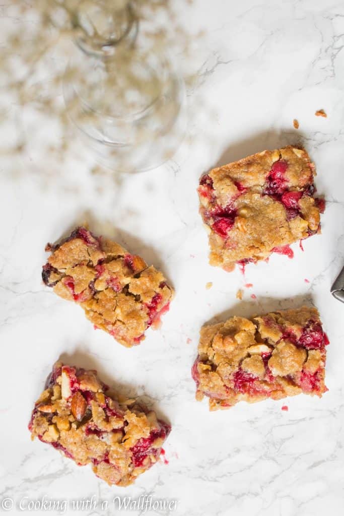 Sweet and tart fresh cranberries baked with a brown sugar butter crust on top. These cranberry crisp bars are so delicious and perfect for the holidays | Cooking With a Wallflower