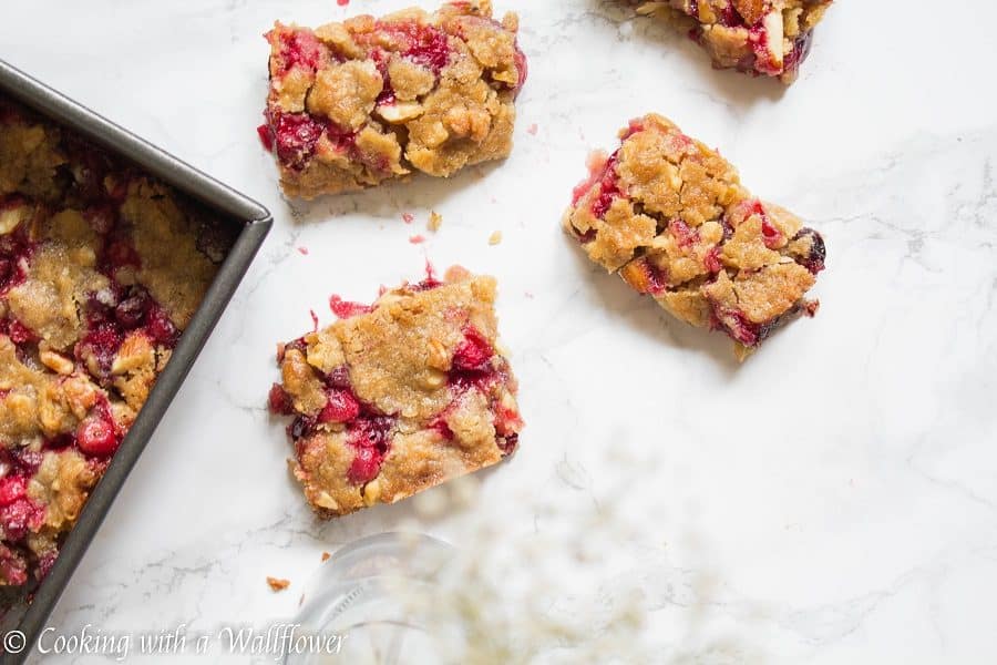 Sweet and tart fresh cranberries baked with a brown sugar butter crust on top. These cranberry crisp bars are so delicious and perfect for the holidays | Cooking With a Wallflower