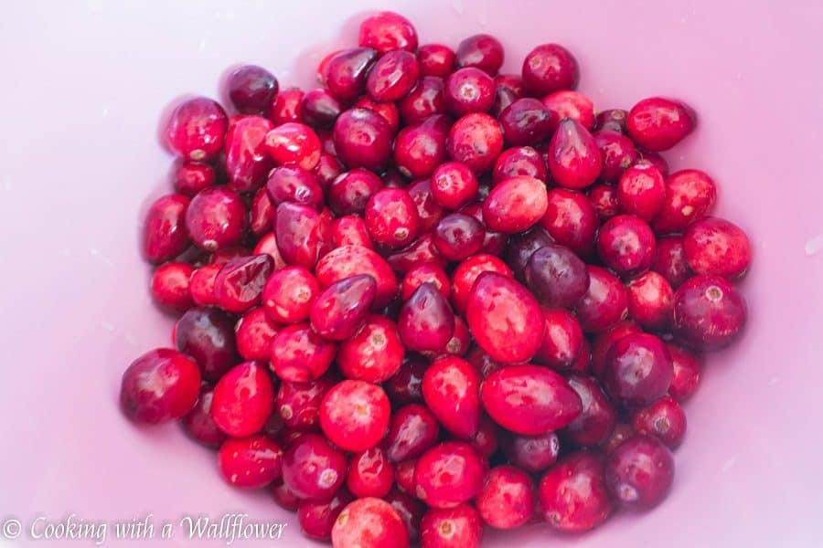 Sweet and tart fresh cranberries baked with a brown sugar butter crust on top. These cranberry crisp bars are so delicious and perfect for the holidays | Cooking With a Wallflower