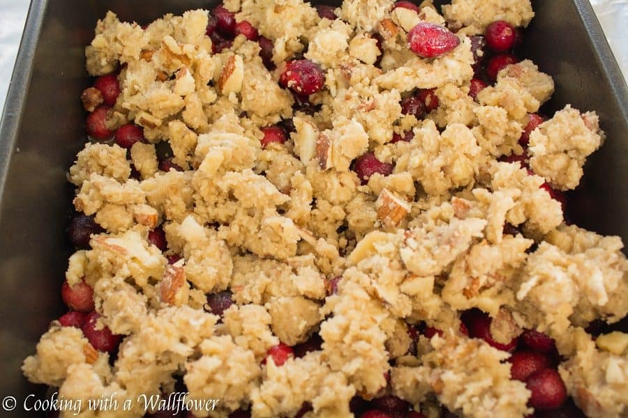 Sweet and tart fresh cranberries baked with a brown sugar butter crust on top. These cranberry crisp bars are so delicious and perfect for the holidays | Cooking With a Wallflower