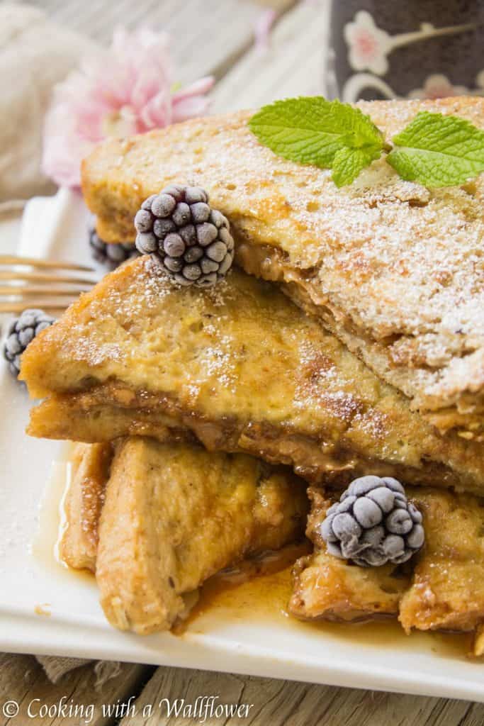 Thick crusty bread stuffed with cookie butter then dipped in a vanilla egg mixture. This cookie butter stuffed French toast is deliciously indulgent, perfect for brunch and special occasions like Mother's Day! | Cooking with a Wallflower