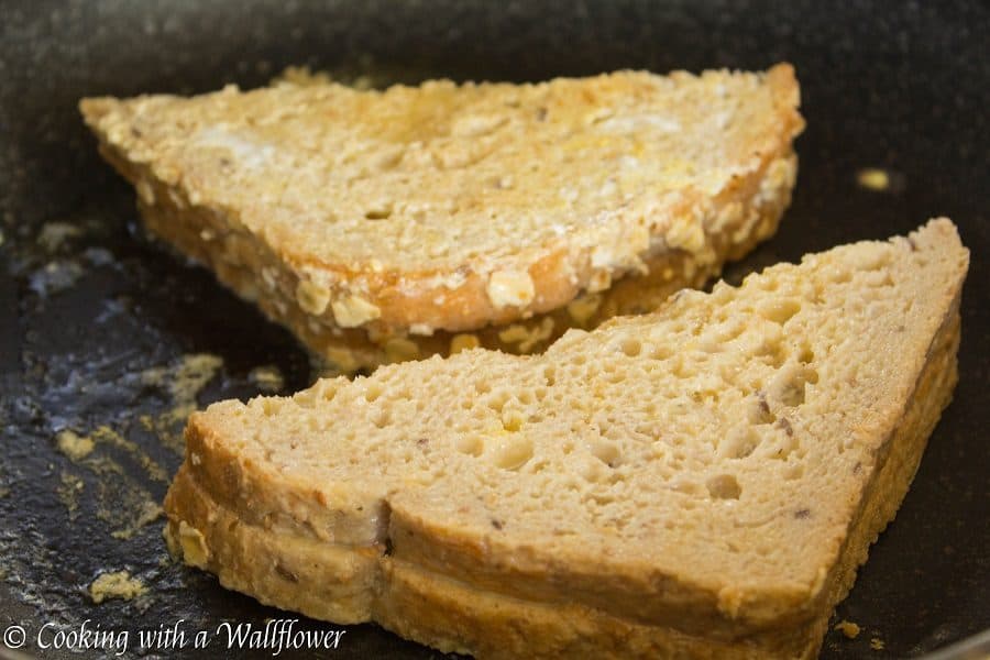 Thick crusty bread stuffed with cookie butter then dipped in a vanilla egg mixture. This cookie butter stuffed French toast is deliciously indulgent, perfect for brunch and special occasions like Mother's Day! | Cooking with a Wallflower