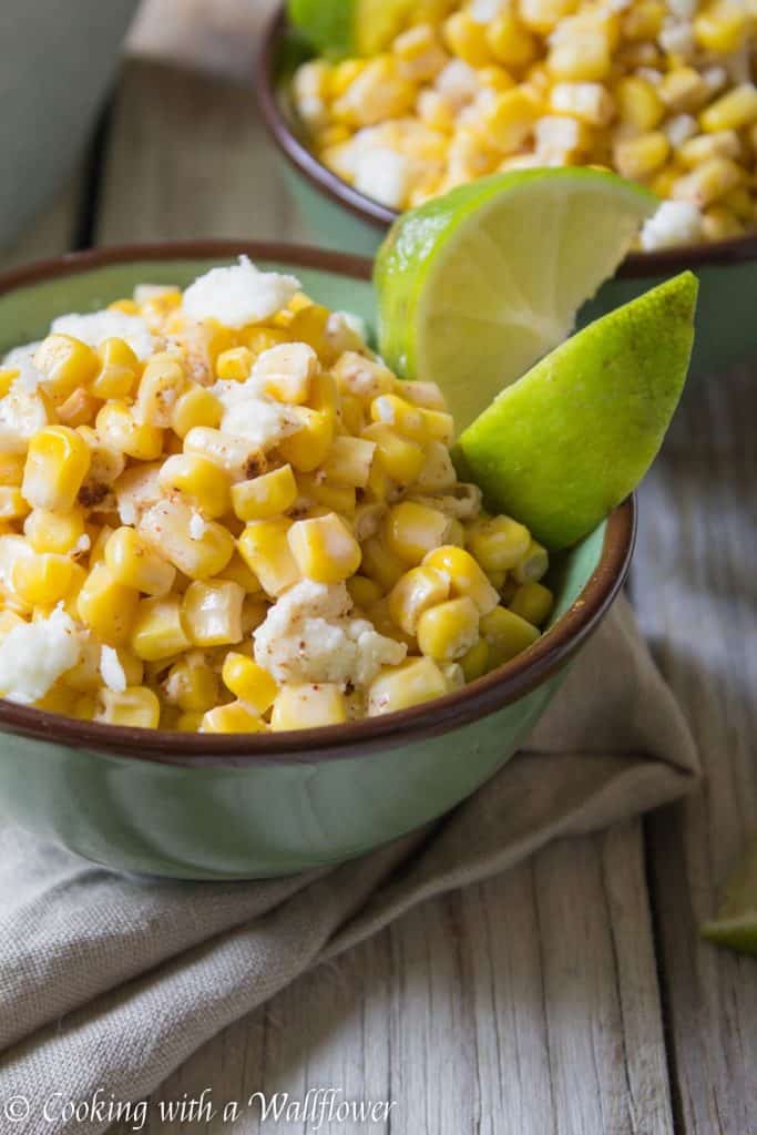 Corn kernels mixed with mayonnaise, melted butter, and queso fresco cheese then seasoned with chili powder and lime juice. This easy to make Mexican Street Corn is delicious and perfect as a side. | Cooking With a Wallflower