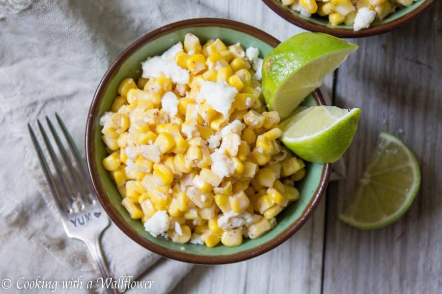 Corn kernels mixed with mayonnaise, melted butter, and queso fresco cheese then seasoned with chili powder and lime juice. This easy to make Mexican Street Corn is delicious and perfect as a side. | Cooking With a Wallflower