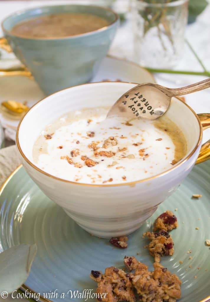 Strong brewed coffee latte served with pumpkin puree, maple syrup, and oats. This maple pumpkin almond oatmeal latte is delicious and perfect for fall. | Cooking With a Wallflower