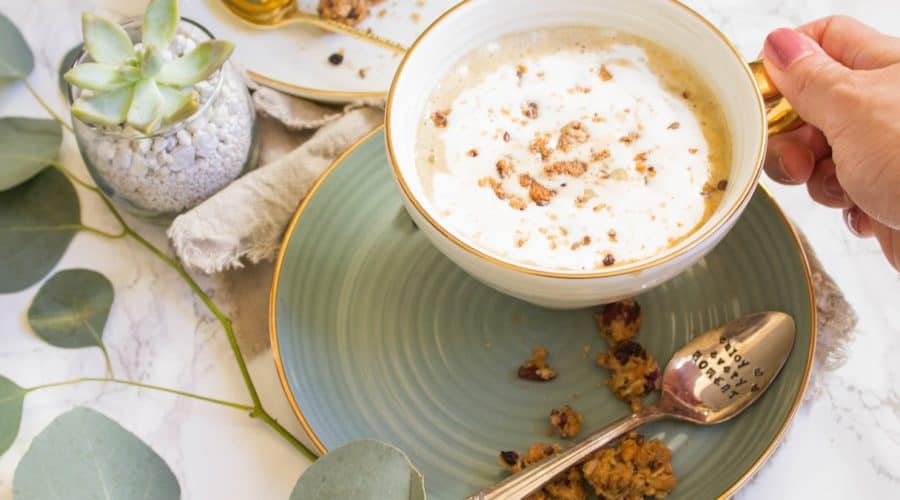 Strong brewed coffee latte served with pumpkin puree, maple syrup, and oats. This maple pumpkin almond oatmeal latte is delicious and perfect for fall. | Cooking With a Wallflower