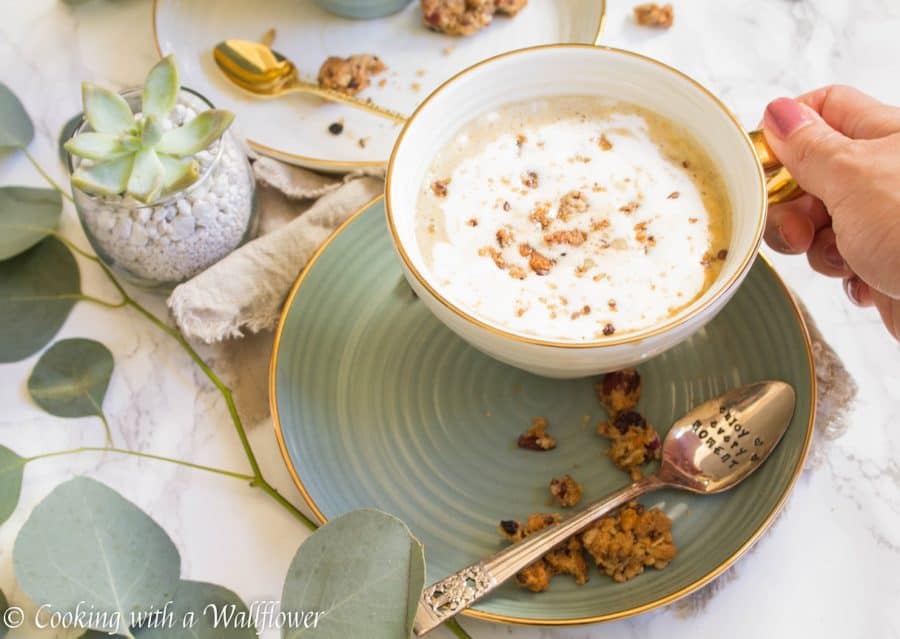 Strong brewed coffee latte served with pumpkin puree, maple syrup, and oats. This maple pumpkin almond oatmeal latte is delicious and perfect for fall. | Cooking With a Wallflower