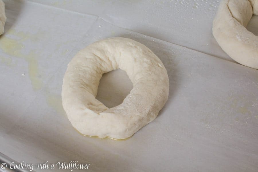 Homemade bagels topped with freshly grated Parmesan cheese, these homemade Parmesan bagels are delicious and easy to make. | Cooking with a Wallflower