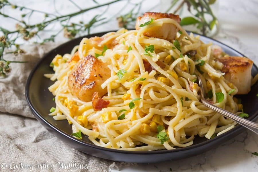 Pasta Carbonara tossed with fresh corn and pan seared scallops is easier than it sounds! This Pasta Carbonara with Pan Seared Scallops is delicious and a great choice for a weeknight dinner. | Cooking with a Wallflower