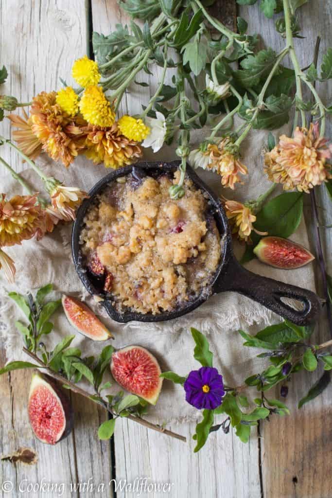 Caramelized figs topped with a buttery, crumble topping. This maple fig crumble is the perfect individually sized dessert for an early autumn dessert. | Cooking with a Wallflower