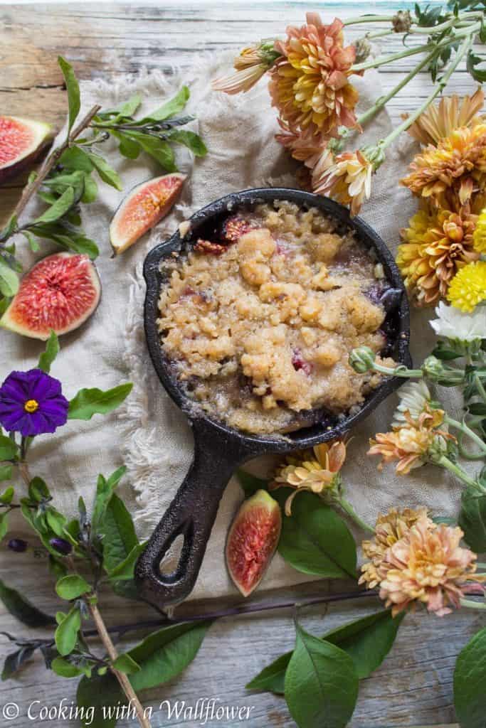 Caramelized figs topped with a buttery, crumble topping. This maple fig crumble is the perfect individually sized dessert for an early autumn dessert. | Cooking with a Wallflower