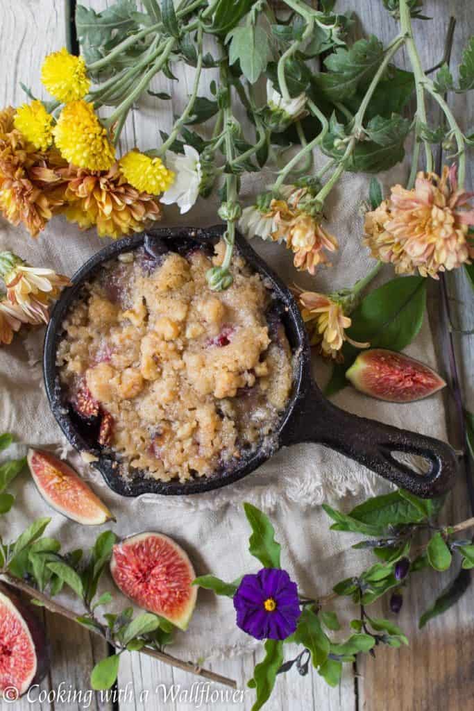 Caramelized figs topped with a buttery, crumble topping. This maple fig crumble is the perfect individually sized dessert for an early autumn dessert. | Cooking with a Wallflower