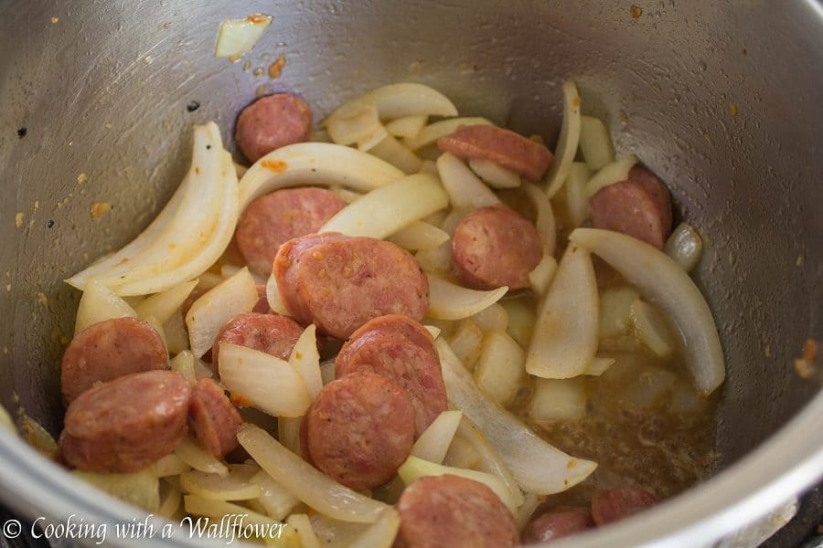 Warm, comforting chili filled with chicken, sausage, and veggies. This smoky chicken and sausage chili is delicious, healthy and perfect for the winter. | Cooking with a Wallflower