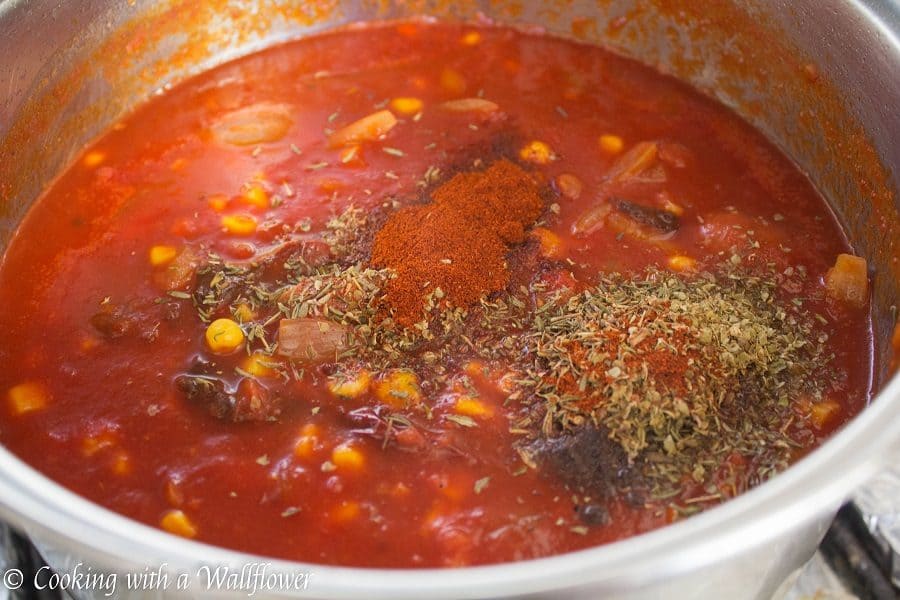 Warm, comforting chili filled with chicken, sausage, and veggies. This smoky chicken and sausage chili is delicious, healthy and perfect for the winter. | Cooking with a Wallflower