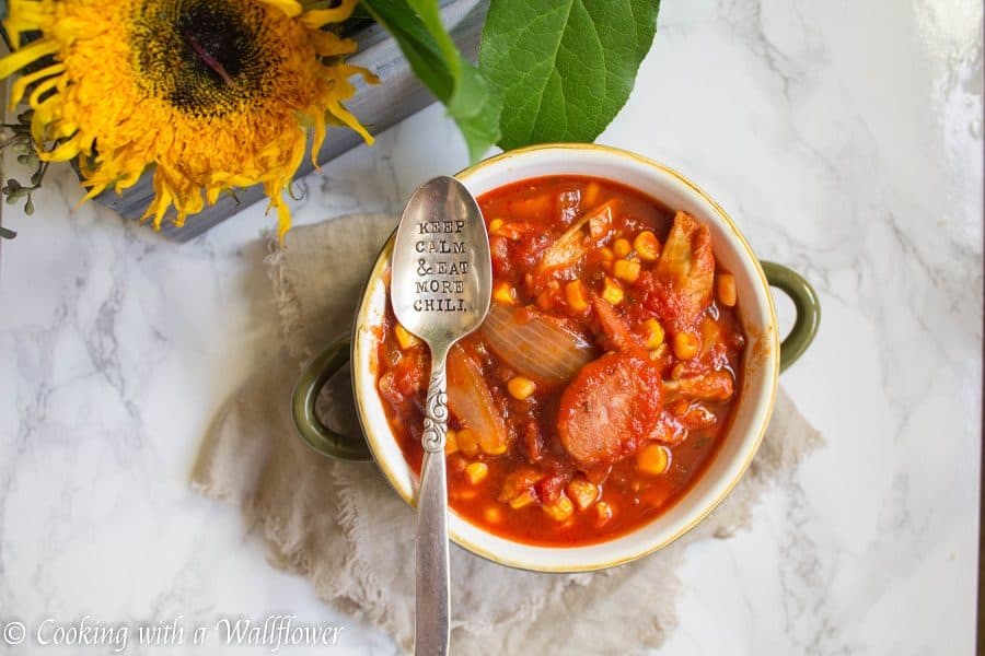 Warm, comforting chili filled with chicken, sausage, and veggies. This smoky chicken and sausage chili is delicious, healthy and perfect for the winter. | Cooking with a Wallflower