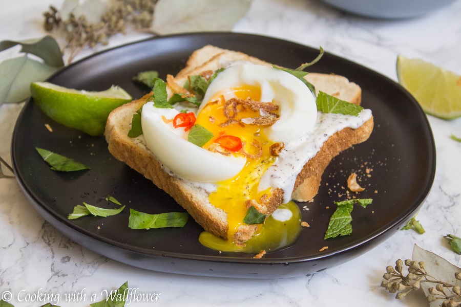 Toast with a garlic za’atar spread, topped with an egg and fresh herbs, this garlic egg toast is delicious, easy to make, and perfect for summer breakfast. | Ask Anna