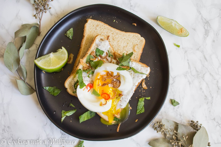 Toast with a garlic za’atar spread, topped with an egg and fresh herbs, this garlic egg toast is delicious, easy to make, and perfect for summer breakfast. | Ask Anna