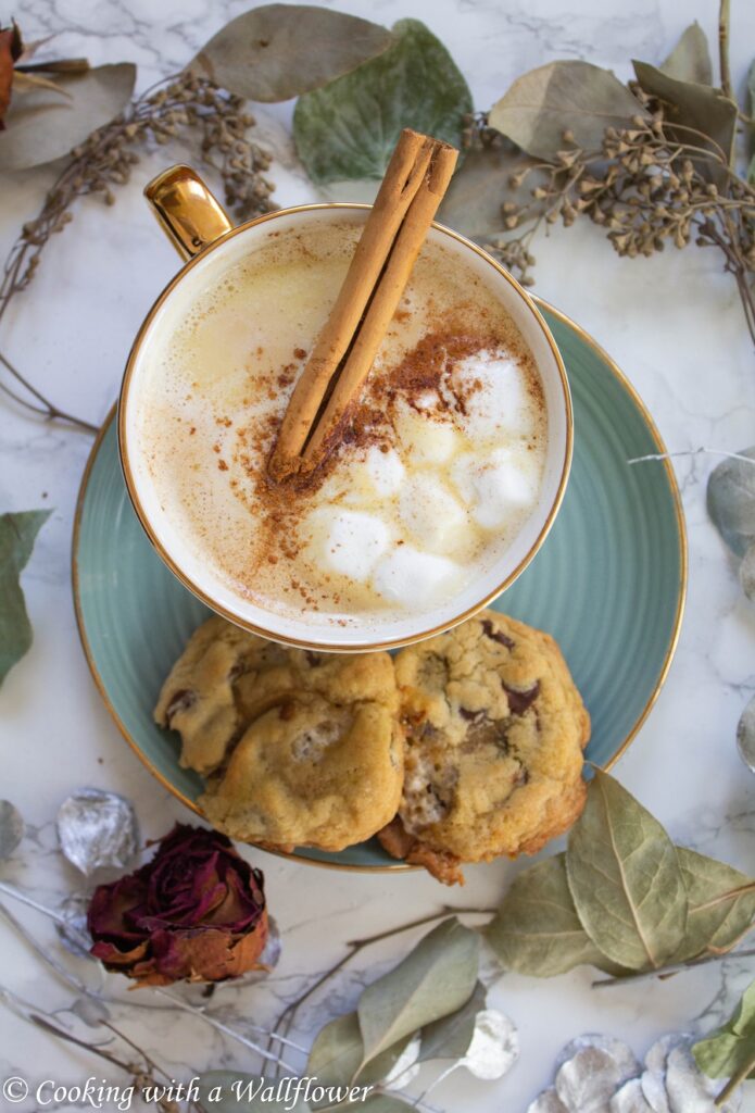 White hot chocolate brewed with chai tea, topped with mini marshmallows and a sprinkle of cinnamon. This chai white hot chocolate is easy to make and perfect for cold winter days. | Cooking With a Wallflower