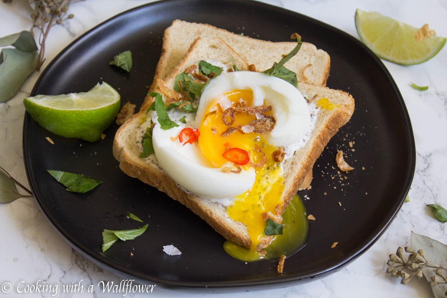 Toast with a garlic za’atar spread, topped with an egg and fresh herbs, this garlic egg toast is delicious, easy to make, and perfect for summer breakfast. | Ask Anna