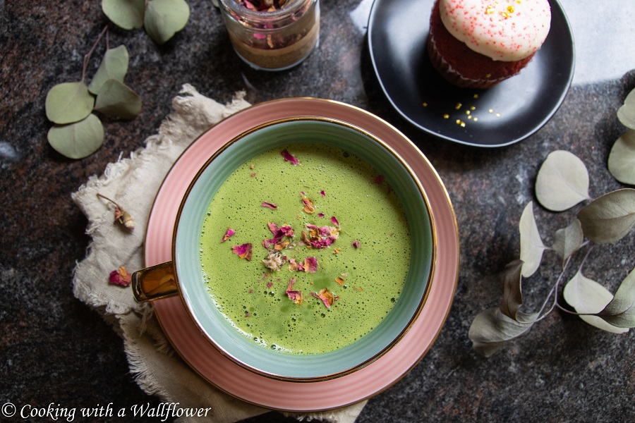 Creamy matcha latte sweetened with rose syrup and topped with dried rose buds. This matcha rose latte is simply delicious with a hint of rose. | Cooking with a Wallflower