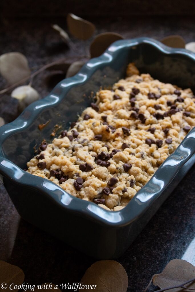 Coffee cake filled with mini chocolate chips, topped with a buttery crumble. This chocolate chip coffee cake is a delicious way to start the day. | Ask Anna